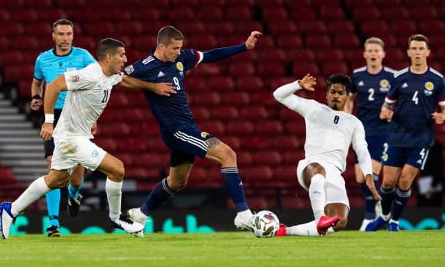 Scotland's Lyndon Dykes and Dor Peretz in action during the UEFA Nations League match between Scotland and Israel at Hampden in September (Photo by Alan Harvey / SNS Group)