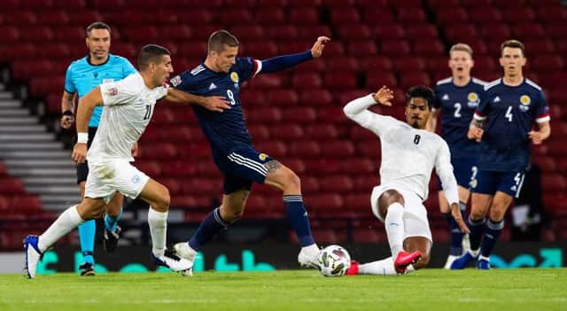 Scotland's Lyndon Dykes and Dor Peretz in action during the UEFA Nations League match between Scotland and Israel at Hampden in September (Photo by Alan Harvey / SNS Group)
