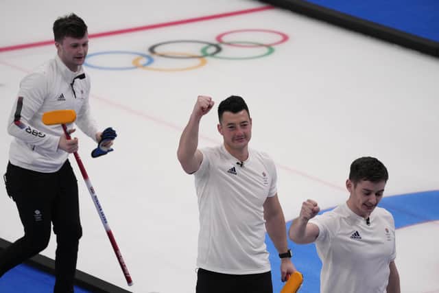 Britain's athletes celebrate after winning the men's curling semifinal match against the United States at the Beijing Winter Olympics Thursday, Feb. 17, 2022, in Beijing. (AP Photo/Nariman El-Mofty)
