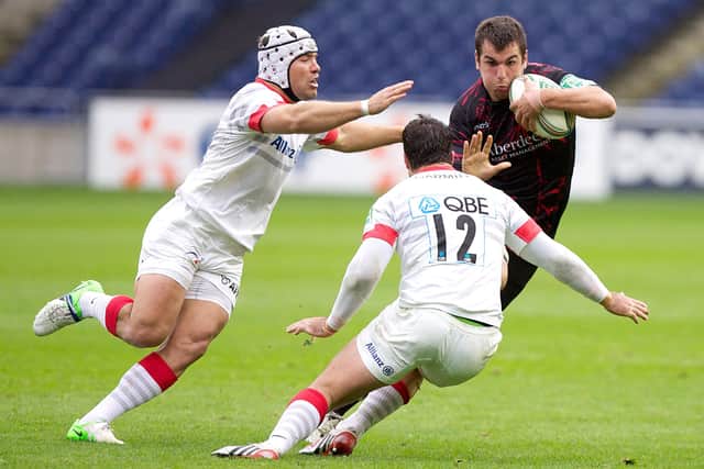 A young Stuart McInally takes on Saracens' Brad Barritt (centre) and Schalk Brits (left) during Edinburgh's Heineken Cup clash at Murrayfield in October 2012. Picture: Chris Clark/PA