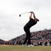 Dustin Johnson of the United States tees off on the 16th hole during Day Two of The 150th Open at St Andrews Old Course on July 15, 2022 in St Andrews, Scotland.