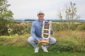 Euan Walker shows off the trophy after winning the weather-hit Swiss Challenge by three shots at Golf Saint Apollinaire in Folgensbourg, France. Picture: Jan Hetfleisch/Getty Images.