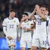 Lawrence Shankland leads his Scotland team-mates in applauding the travelling supporters after the 2-2 draw in Georgia. (Photo by GIORGI ARJEVANIDZE/AFP via Getty Images)