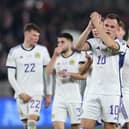 Lawrence Shankland leads his Scotland team-mates in applauding the travelling supporters after the 2-2 draw in Georgia. (Photo by GIORGI ARJEVANIDZE/AFP via Getty Images)
