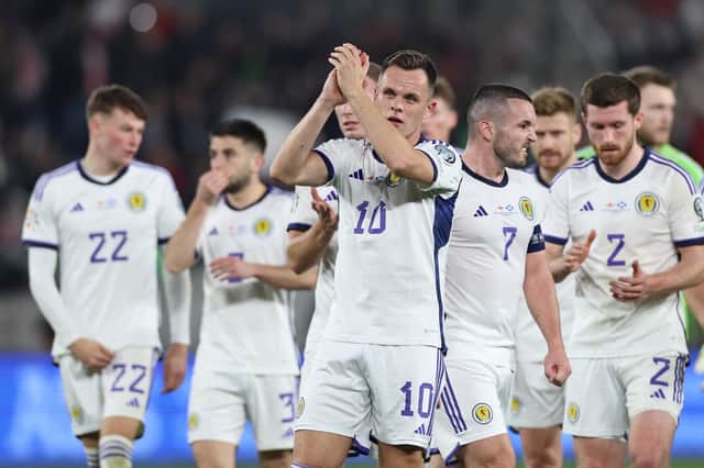 Lawrence Shankland leads his Scotland team-mates in applauding the travelling supporters after the 2-2 draw in Georgia. (Photo by GIORGI ARJEVANIDZE/AFP via Getty Images)