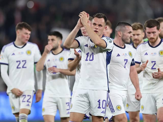 Lawrence Shankland leads his Scotland team-mates in applauding the travelling supporters after the 2-2 draw in Georgia. (Photo by GIORGI ARJEVANIDZE/AFP via Getty Images)