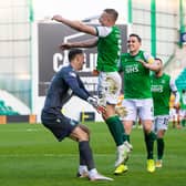 Hibs' goalkeeper Matt Macey prepares to ceebrate with Ryan Porteous after the defender scores the winning penalty in in the shoot out with Motherwell. Photo by Ross Parker / SNS Group