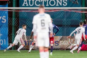 Hamilton's Andy Ryan (L) has his penalty saved by Kilmarnock goalkeeper Zach Hemming during a Cinch Championship match between Hamilton and Kilmarnock at the Fountain of Youth Stadium, on December 26, 2021, in Hamilton, Scotland (Photo by Sammy Turner / SNS Group)