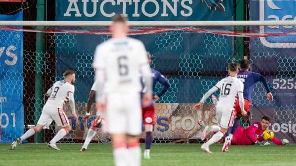 Hamilton's Andy Ryan (L) has his penalty saved by Kilmarnock goalkeeper Zach Hemming during a Cinch Championship match between Hamilton and Kilmarnock at the Fountain of Youth Stadium, on December 26, 2021, in Hamilton, Scotland (Photo by Sammy Turner / SNS Group)