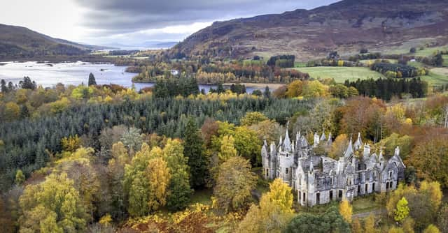 The ruins of Dunalastair House, near Pitlochry, Perthshire, are surrounded by trees displaying their autumn colours.