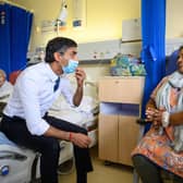 Prime Minister Rishi Sunak speaks with patient Sreeja Gopalan during a visit to Croydon University Hospital, south London on Friday.Leon Neal/PA Wire