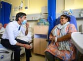Prime Minister Rishi Sunak speaks with patient Sreeja Gopalan during a visit to Croydon University Hospital, south London on Friday.Leon Neal/PA Wire