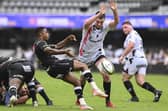 Ewan Johnson of Oyonnax charges down a kick from Grant Williams of Hollywoodbets Sharks during the EPCR Challenge Cup match at Hollywoodbets Kings Park on January 13, 2024 in Durban, South Africa. Johnson has been named in the Scotland summer tour squad. (Photo by Steve Haag Sports/Shutterstock)