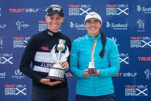 Kelsey MacDonald, right, shows off the Jock MacVicar Leading Scot Trophy alongside Trust Golf Scottish Women's Open winner Ryann O'Toole at Dumbarnie Links. Picture: Tristan Jones