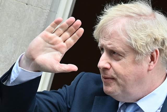 Boris Johnson waves as he leaves from 10 Downing Street in central London. Picture: Justin Tallis/AFP via Getty Images