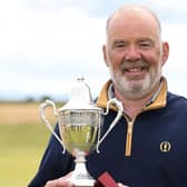 Erskine's Ronnie Clark was delighted to get his hands on the Scottish Seniors' Open trophy for a second time after his win at Arbroath. Picture: Scottish Golf