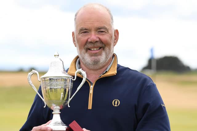 Erskine's Ronnie Clark was delighted to get his hands on the Scottish Seniors' Open trophy for a second time after his win at Arbroath. Picture: Scottish Golf