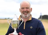 Erskine's Ronnie Clark was delighted to get his hands on the Scottish Seniors' Open trophy for a second time after his win at Arbroath. Picture: Scottish Golf