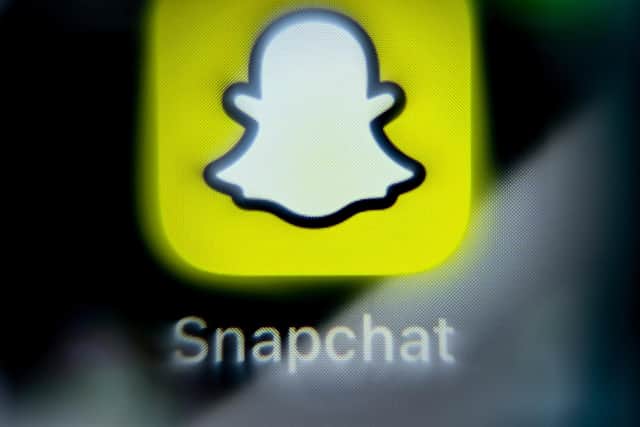 A photo taken on April 3rd, 2024, shows the logo of online messenger Snapchat on a smartphone screen. (Photo by Kirill KUDRYAVTSEV / AFP) (Photo by KIRILL KUDRYAVTSEV/AFP via Getty Images)