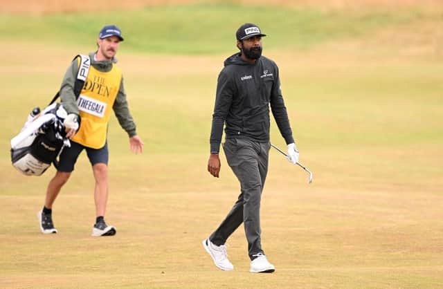 Sahith Theegala and his caddie on the fourth hole at St Andrews. Picture: Ross Kinnaird/Getty Images.