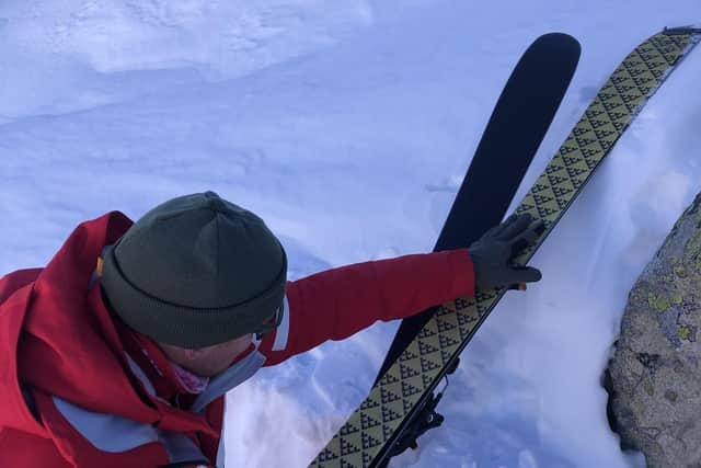 Instructor Luc Smith putting skins on skis for ski touring in Vaujany. Pic: Lauren Taylor/PA.