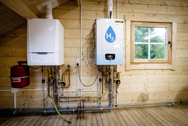 An old central heating boiler side-by-side with a hydrogen boiler (Picture: Sem van der Wal/ANP/AFP via Getty Images)