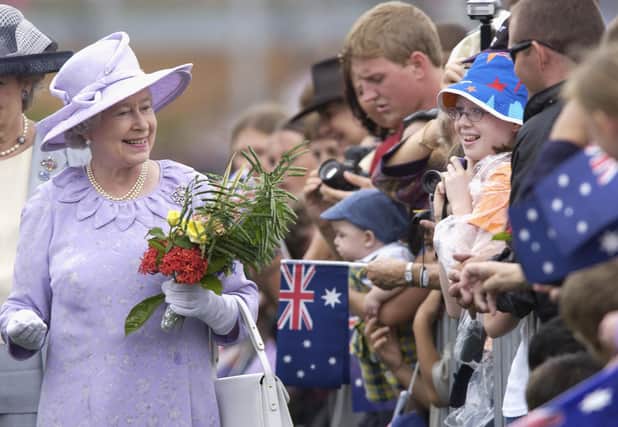 The Queen meets her Australian fans at the Roma Street Parklands in Brisbane, Australia in 2002. The Commonwealth stands as Elizabeth II’s global legacy (Picture: Darren England/Getty Images)