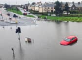 A car trapped due to heavy flooding in Granton, Edinburgh. Picture: John Devlin