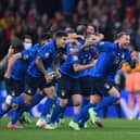 Italy's players celebrate after winning the semi-final shoot-out against Spain at Wembley (Photo by LAURENCE GRIFFITHS/POOL/AFP via Getty Images)