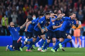 Italy's players celebrate after winning the semi-final shoot-out against Spain at Wembley (Photo by LAURENCE GRIFFITHS/POOL/AFP via Getty Images)