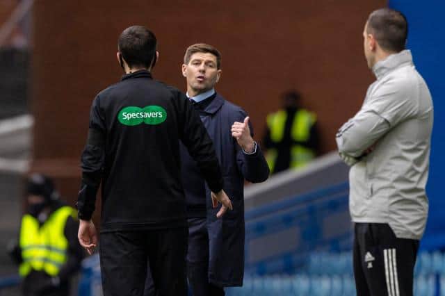 Rangers manager Steven Gerrard makes his point to Celtic interim manager John Kennedy during the closing stages of the Scottish Cup fifth round tie at Ibrox. (Photo by Craig Williamson / SNS Group)