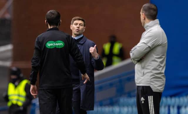 Rangers manager Steven Gerrard makes his point to Celtic interim manager John Kennedy during the closing stages of the Scottish Cup fifth round tie at Ibrox. (Photo by Craig Williamson / SNS Group)