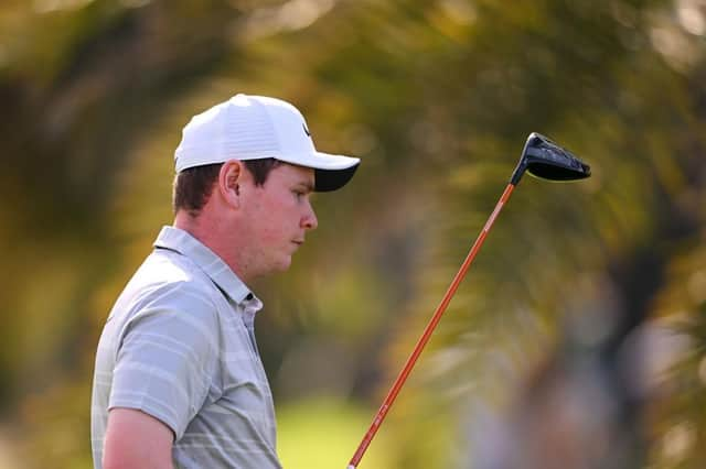 Frustration is etched on Bob MacIntyre's face as he walks off the 18th tee during the third round of the Hero Dubai Desert Classic at Emirates Golf Club. Picture: Ross Kinnaird/Getty Images.