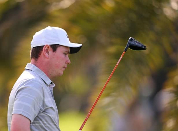 Frustration is etched on Bob MacIntyre's face as he walks off the 18th tee during the third round of the Hero Dubai Desert Classic at Emirates Golf Club. Picture: Ross Kinnaird/Getty Images.