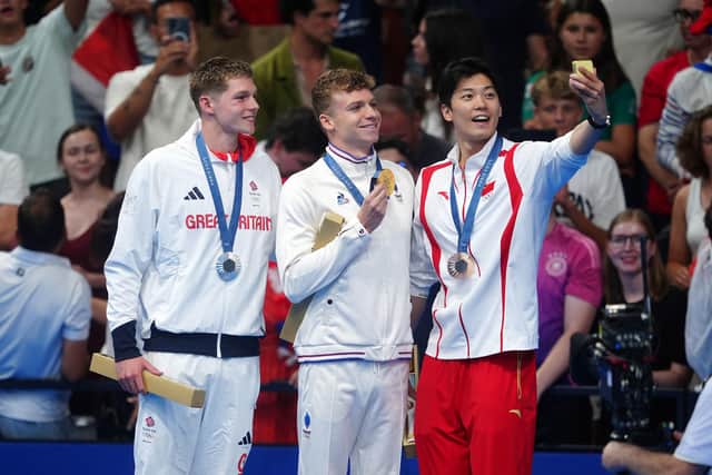 Great Britain’s Duncan Scott, (left) France’s Leon Marchand (centre) and China’s Shun Wang.