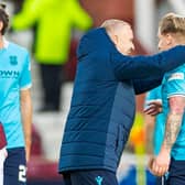 Leigh Griffiths congratulates Jason Cummings on his equaliser against Hearts for Dundee.