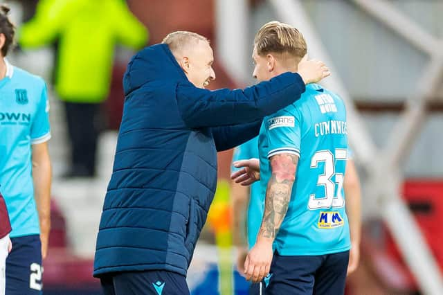 Leigh Griffiths congratulates Jason Cummings on his equaliser against Hearts for Dundee.