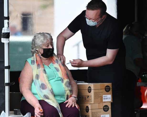 A woman receives her Covid vaccination at Govan Housing Association car park (Picture: John Devlin)