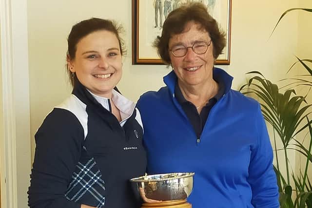 Alyssa Henderson (The Renaissance Club) shows off the East Lothian Women's trophy after it was presented to her by ELCGA president Elaine Dick at the Glen.