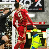 Aberdeen's Bojan Miovski collides with Hibernian's David Marshall - the Dons felt it was a penalty.