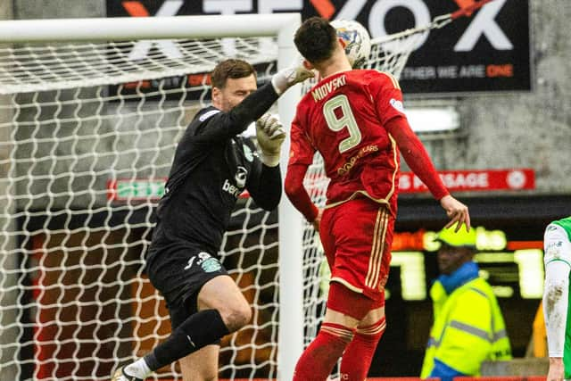 Aberdeen's Bojan Miovski collides with Hibernian's David Marshall - the Dons felt it was a penalty.