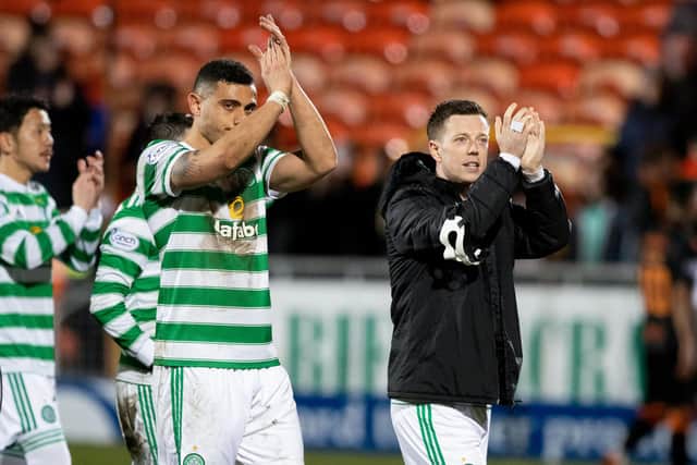 Celtic's Giorgis Giakoumakis and Callum McGregor applaud the fans following the 3-0 Scottish Cup quarter final victory away to Dundee United which has exalted the double-scoring Greek striker and his now 30 domestic games without a defeat team. (Photo by Craig Williamson / SNS Group)