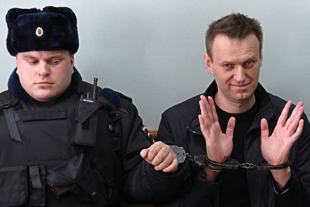 Kremlin critic Alexei Navalny (right), who was arrested during March 26 anti-corruption rally, gestures during an appeal hearing at a court in Moscow. Picture: Kirill Kudryavtsev/AFP via Getty Images