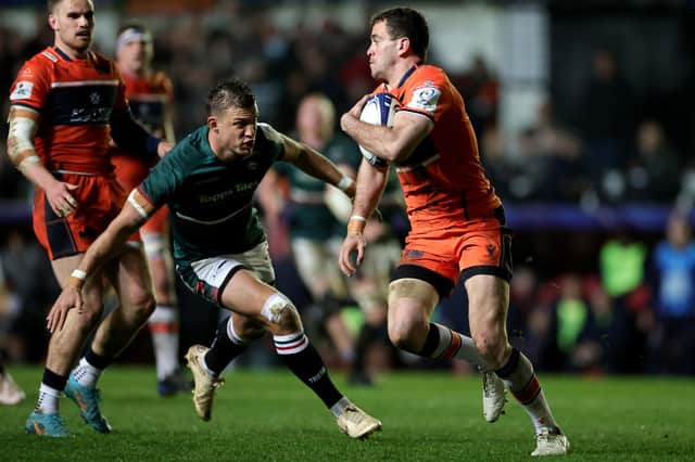 Leicester Tigers' stand-off Handre Pollard eyes up a tackle on Edinburgh's Emiliano Boffelli as the Scottish outfit crashed out of the Heineken Cup.