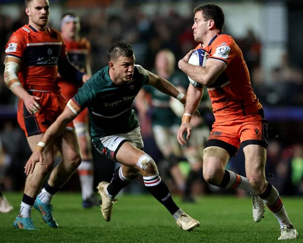 Leicester Tigers' stand-off Handre Pollard eyes up a tackle on Edinburgh's Emiliano Boffelli as the Scottish outfit crashed out of the Heineken Cup.