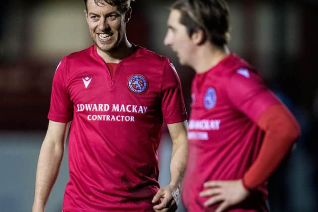 BRORA, SCOTLAND - MARCH 23: Brora's Martin MacLean (L) during a Scottish Cup tie between Brora Rangers and Hearts at Dudgeon Park, on March 23, 2021, in Brora, Scotland. (Photo by Ross Parker / SNS Group)