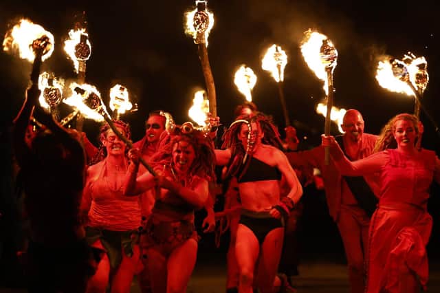 Members of the Beltane Fire Society take part in Samhuinn Fire Festival  (Photo by Jeff J Mitchell/Getty Images)