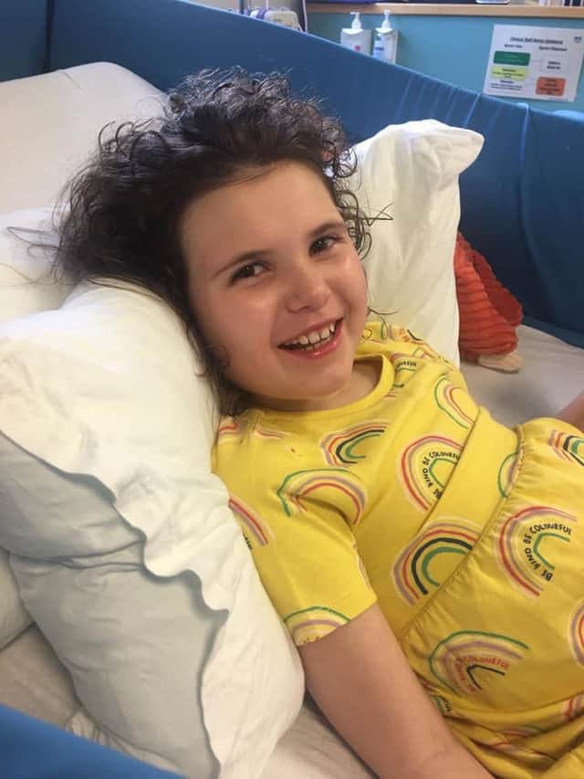 Eliza smiling in hospital.