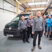 Simon Poole, co-founder of the campervan firm, and team. Picture: contributed.