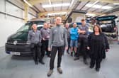 Simon Poole, co-founder of the campervan firm, and team. Picture: contributed.